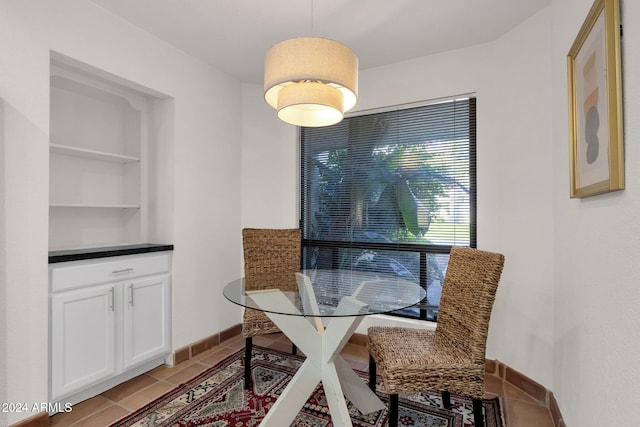 dining area featuring light tile patterned flooring