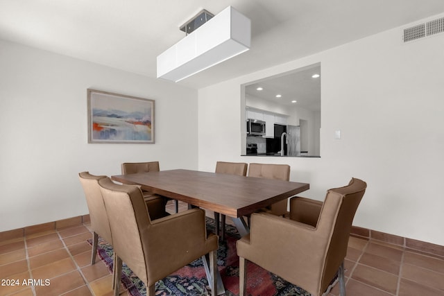 dining room featuring tile patterned flooring