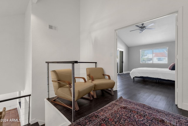 bedroom with ceiling fan, dark hardwood / wood-style floors, and vaulted ceiling