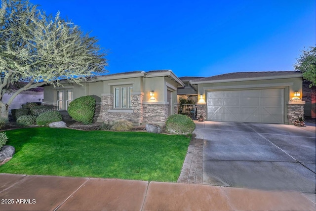 view of front of property with driveway, stone siding, a garage, and stucco siding