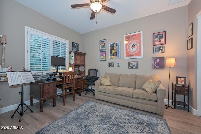 office featuring ceiling fan, baseboards, and wood finished floors