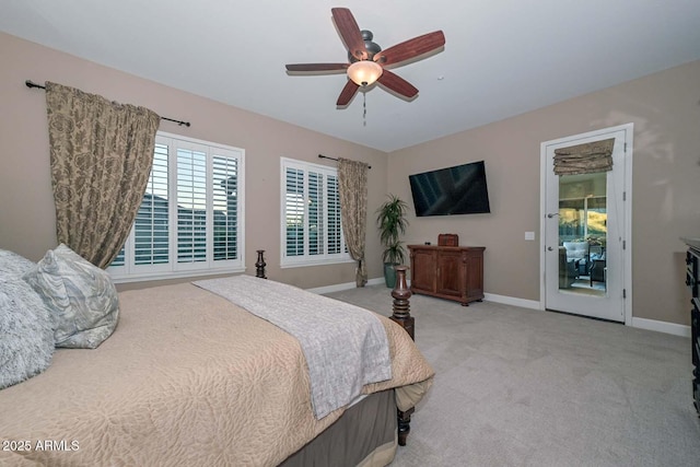 bedroom with a ceiling fan, light colored carpet, and baseboards