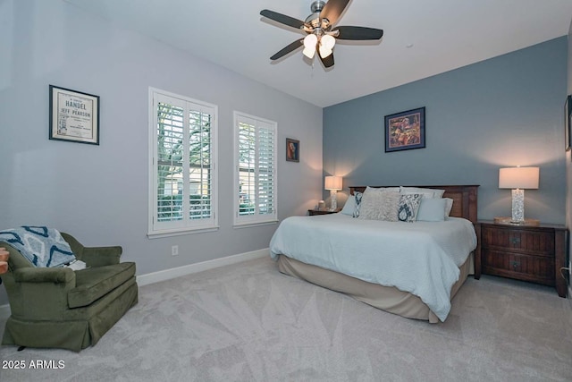 bedroom with a ceiling fan, carpet, and baseboards