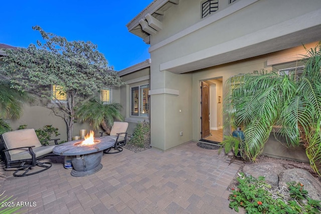 view of patio featuring a fire pit