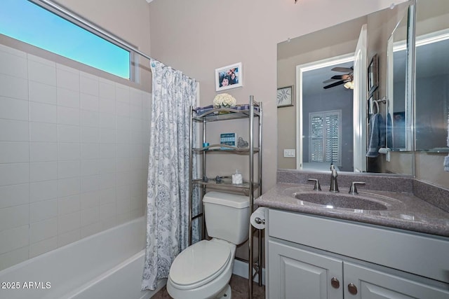 bathroom with toilet, shower / bath combo, a ceiling fan, and vanity