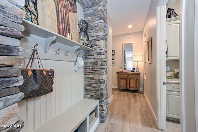 mudroom with light wood-style floors, recessed lighting, and baseboards