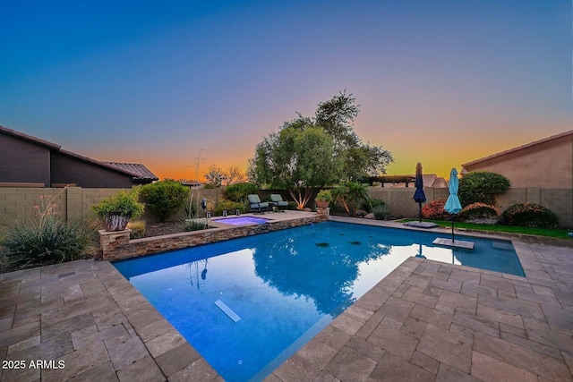 view of pool with a patio, a fenced backyard, a fenced in pool, and an in ground hot tub