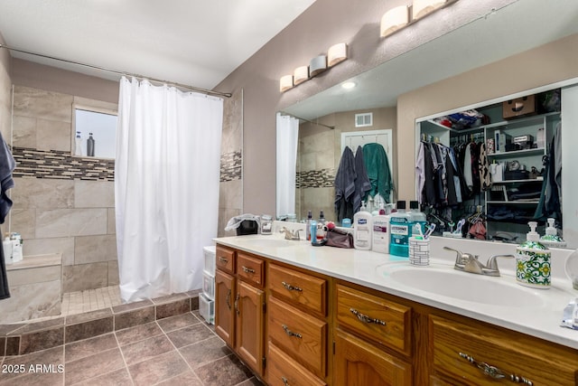 5354 E Ellis St, Mesa, AZ 85205 - bathroom featuring tiled shower and double vanity