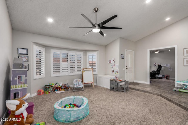 5354 E Ellis St, Mesa, AZ 85205 - recreation room featuring ceiling fan, lofted ceiling, carpet floors, recessed lighting, and a textured ceiling