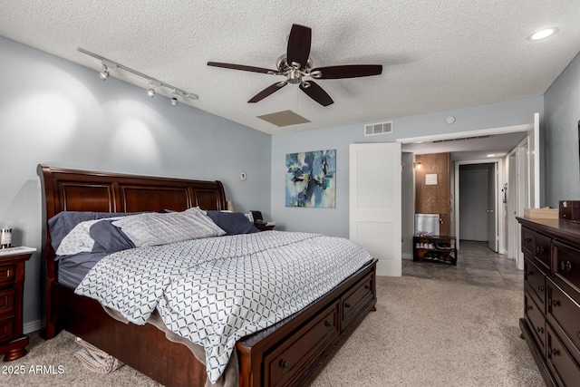 5354 E Ellis St, Mesa, AZ 85205 - bedroom featuring a textured ceiling, a ceiling fan, and light carpet