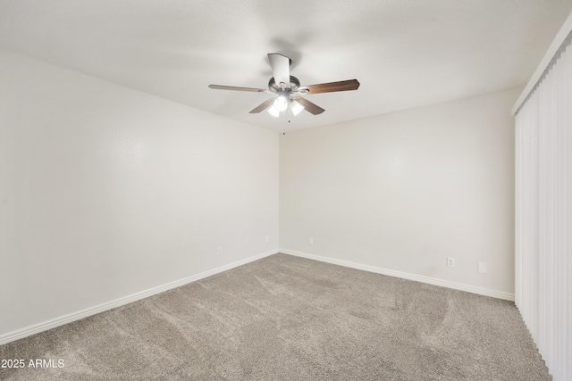 spare room featuring carpet floors and ceiling fan