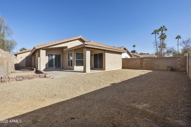 rear view of house featuring a patio