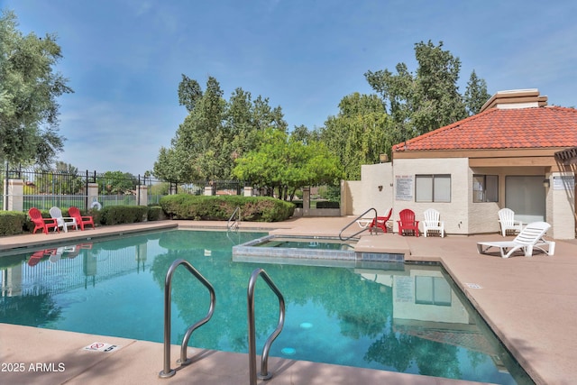 view of pool with a community hot tub and a patio