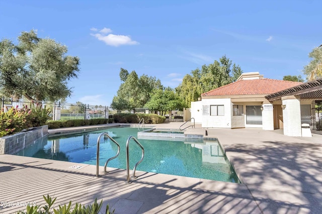 view of swimming pool with a patio area