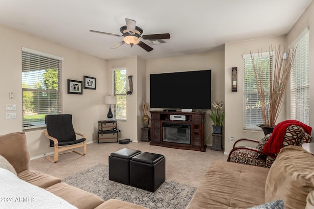 tiled living room featuring ceiling fan