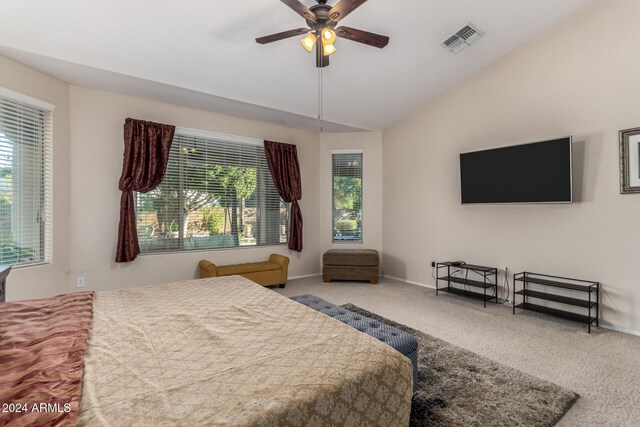 bedroom featuring ceiling fan, carpet floors, and vaulted ceiling