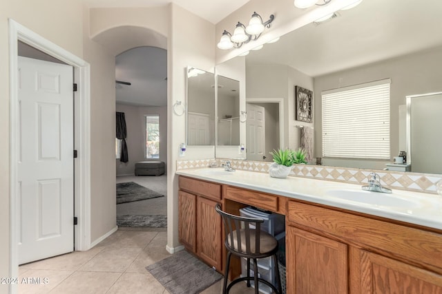 bathroom with tile patterned floors and vanity