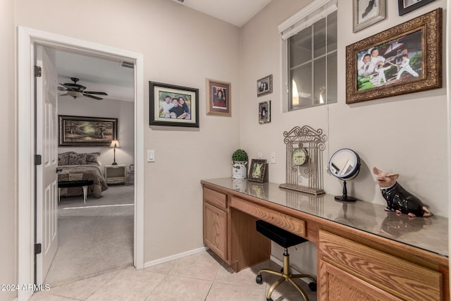 tiled office featuring ceiling fan