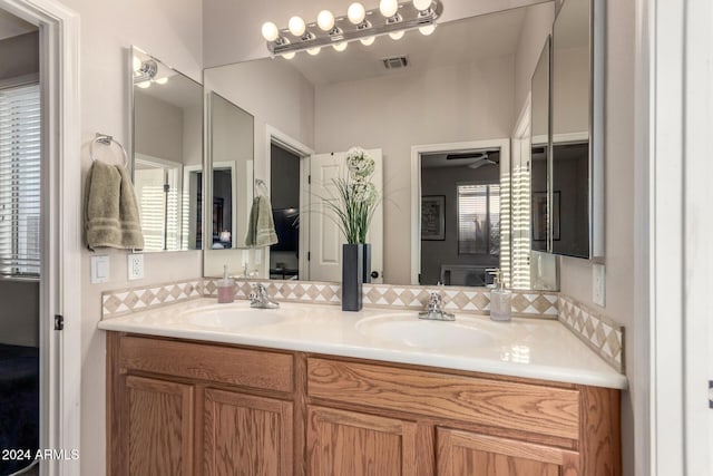 bathroom featuring ceiling fan and vanity