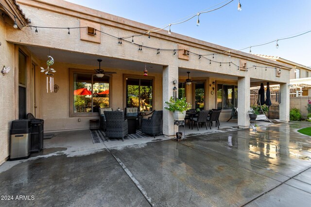 back of house featuring ceiling fan and a patio area