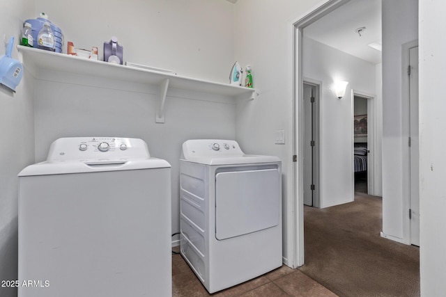 laundry room featuring dark colored carpet and washing machine and clothes dryer