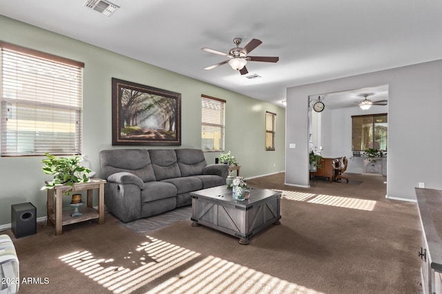 carpeted living room featuring ceiling fan