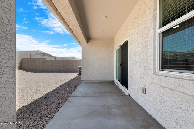 view of patio featuring fence and central AC