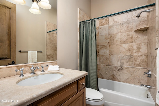 full bathroom featuring shower / bath combination with curtain, toilet, and vanity