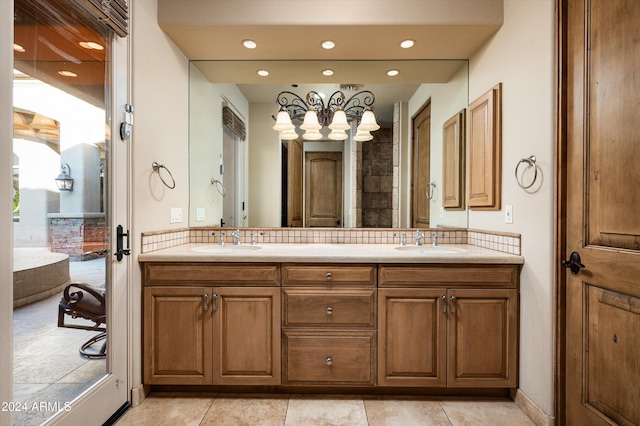 bathroom featuring tile patterned floors, decorative backsplash, and vanity