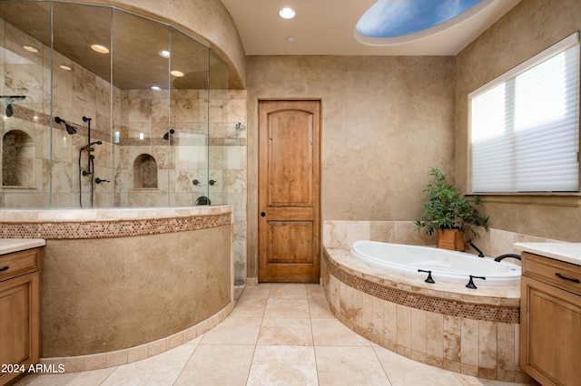 bathroom featuring tile patterned flooring, vanity, separate shower and tub, and tile walls