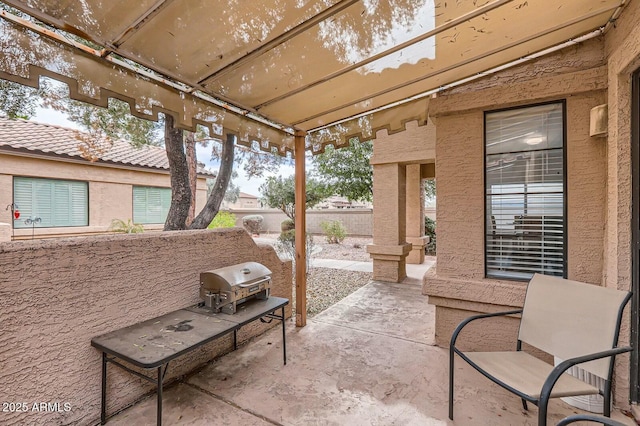 view of patio featuring a grill