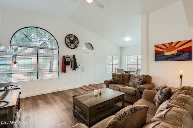 living room featuring a ceiling fan, lofted ceiling, dark wood-style flooring, and baseboards