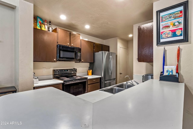 kitchen featuring sink, black appliances, dark brown cabinets, and a textured ceiling