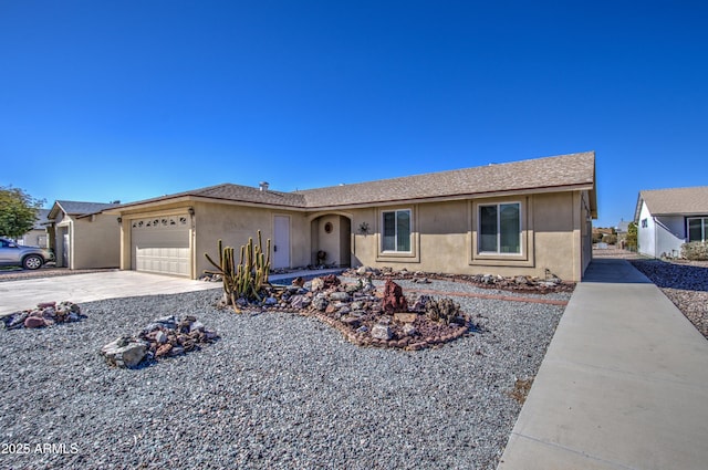 ranch-style house featuring a garage