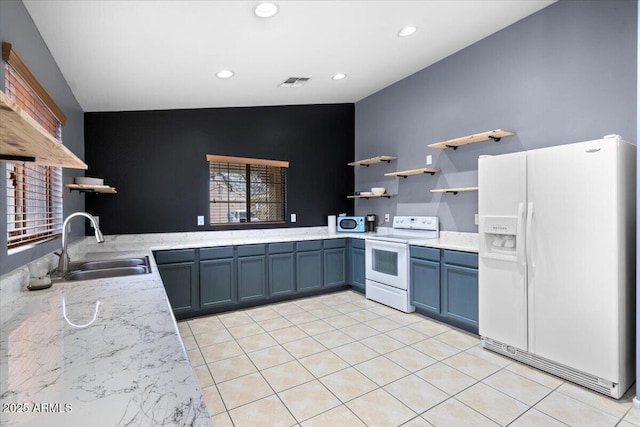 kitchen featuring light tile patterned flooring, white appliances, a sink, visible vents, and open shelves