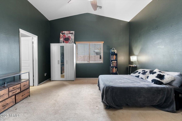 bedroom featuring lofted ceiling, visible vents, ceiling fan, and light carpet