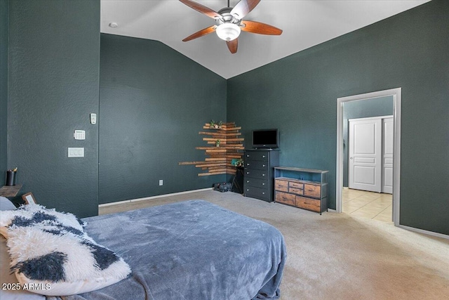 carpeted bedroom with vaulted ceiling, ceiling fan, and baseboards