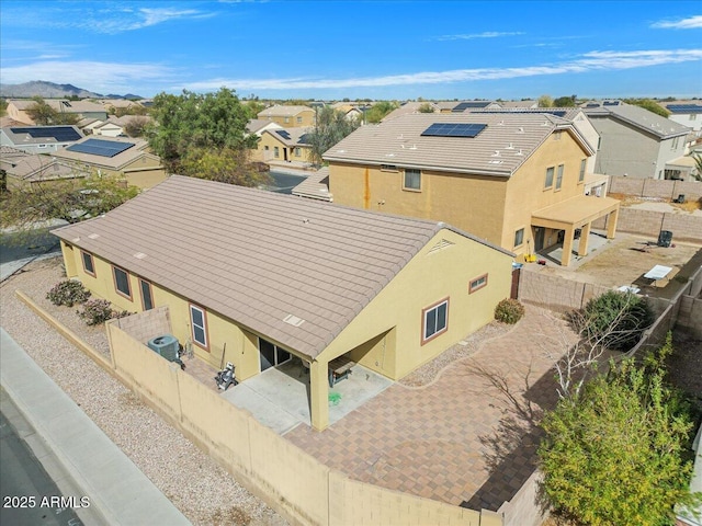 birds eye view of property with a residential view