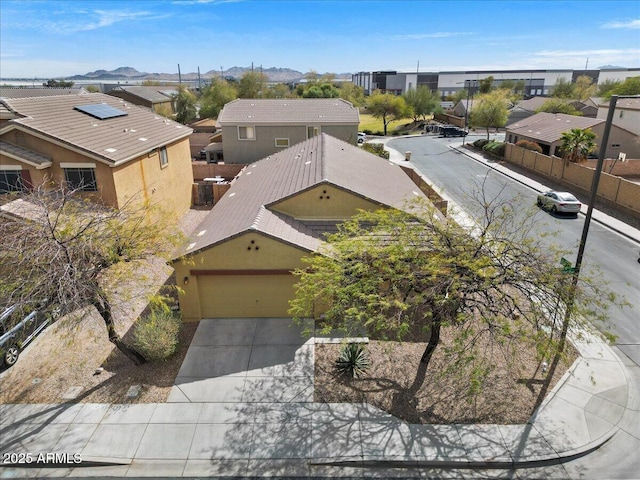 aerial view featuring a mountain view and a residential view