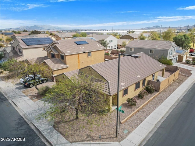 drone / aerial view with a residential view and a mountain view