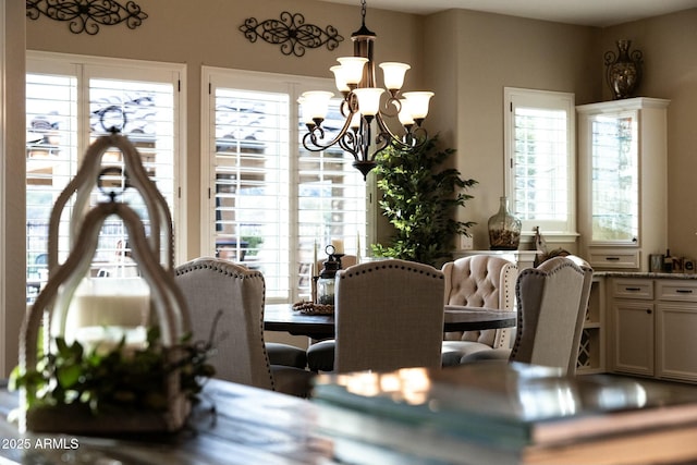 dining space featuring a notable chandelier