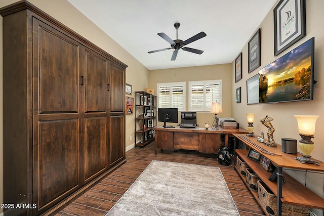 office space featuring baseboards, a ceiling fan, and wood tiled floor