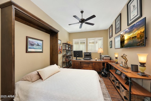 bedroom featuring dark wood-style flooring and ceiling fan