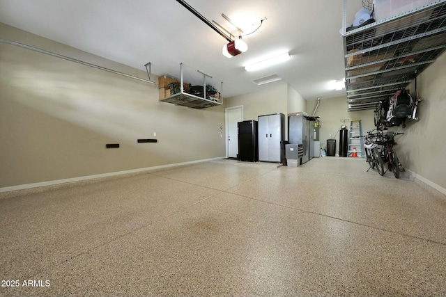 garage with a garage door opener and baseboards