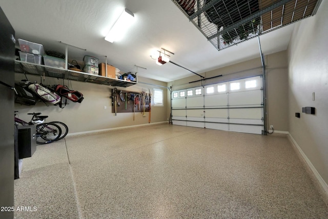 garage featuring baseboards and a garage door opener