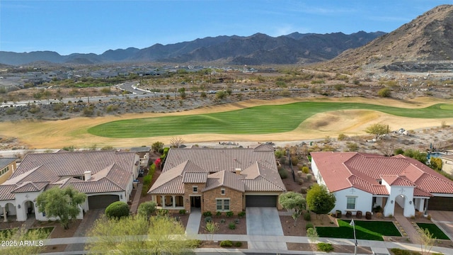 birds eye view of property featuring golf course view and a mountain view