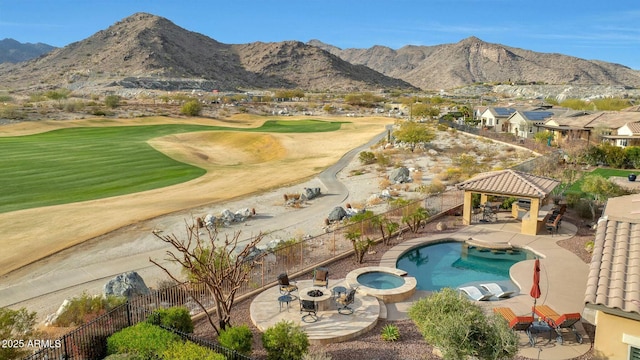 exterior space with fence, a mountain view, a patio, and a gazebo