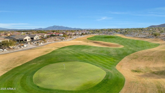 view of property's community with golf course view, a residential view, and a mountain view