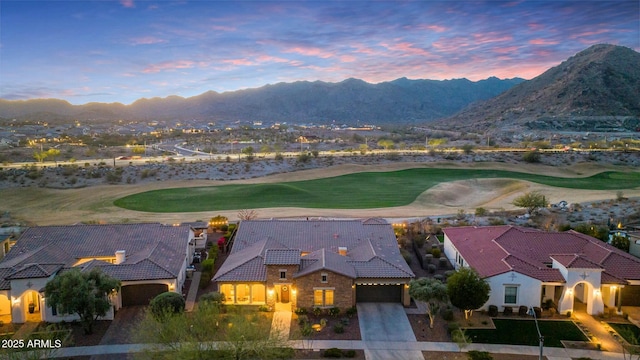 exterior space with view of golf course and a mountain view