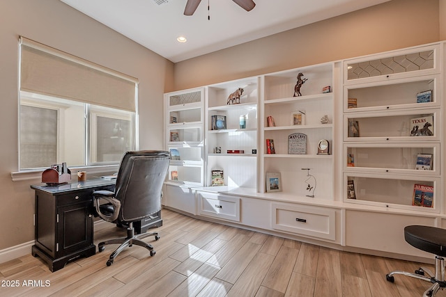 office space featuring ceiling fan and light wood-type flooring